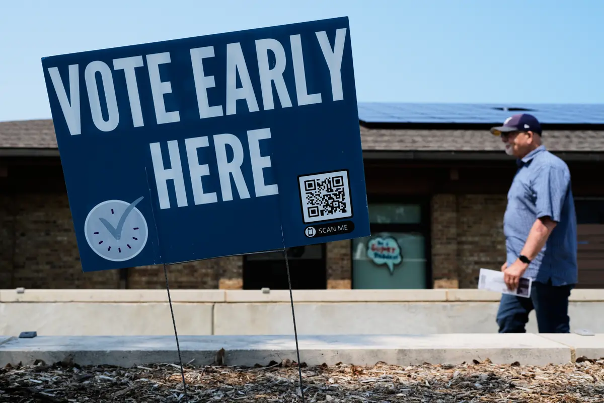 A voter walks to a polling place in Milwaukee, Wis., on July 28, 2026. (Nam Y. Huh/AP)