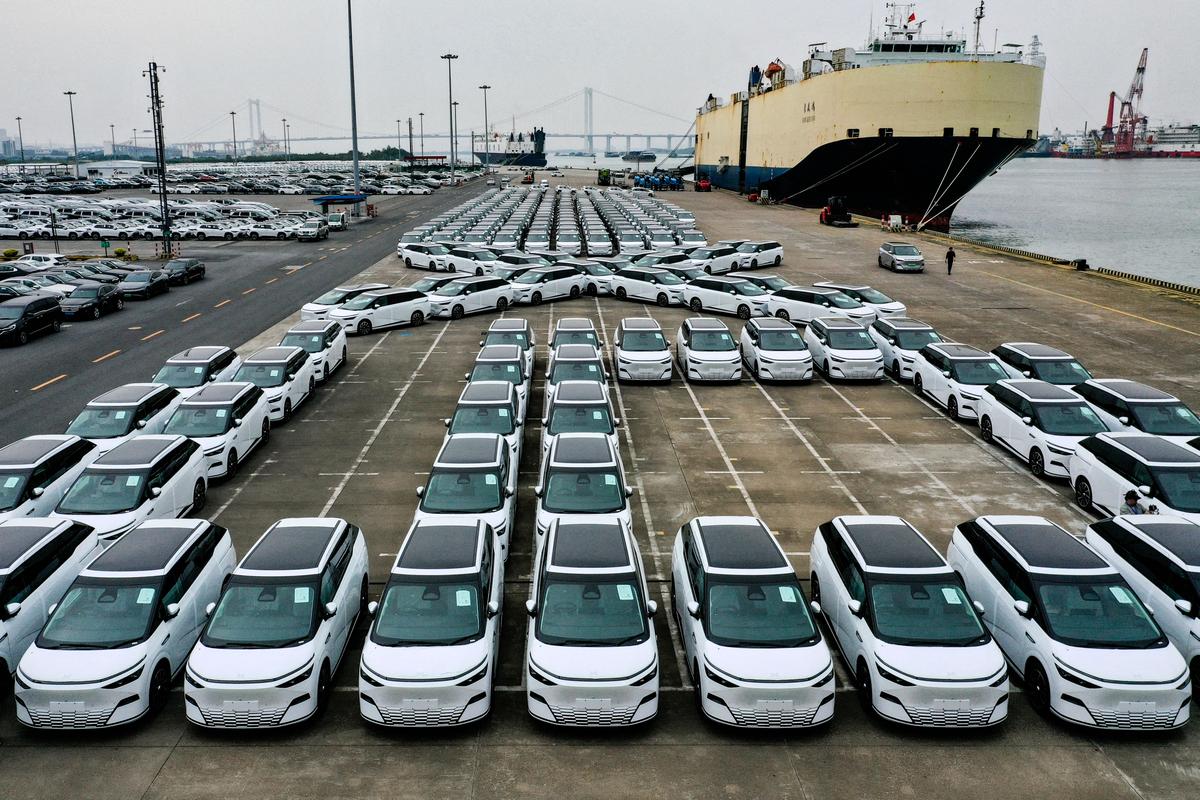 An aerial photo shows X9 electric vehicles by Chinese EV manufacturer XPeng waiting to be loaded on a ship of the NYK line for Thailand during a ceremony in the Port of Guangzhou, China's southern Guangdong province on Feb. 22, 2025. (Pedro Pardo/AFP via Getty Images)
