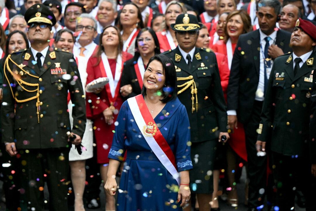 TOPSHOT - Peru's President Keiko Fujimori walks toward the Government Palace after leaving Congress following her inauguration ceremony in Lima on July 28, 2026. Fujimori took office on July 28, 2026, vowing to tackle the wave of crime sweeping the Andean nation. Fujimori won the June 7 presidential runoff by fewer than 50,000 votes, after losing the past three runoffs. (Photo by ERNESTO BENAVIDES / AFP via Getty Images)