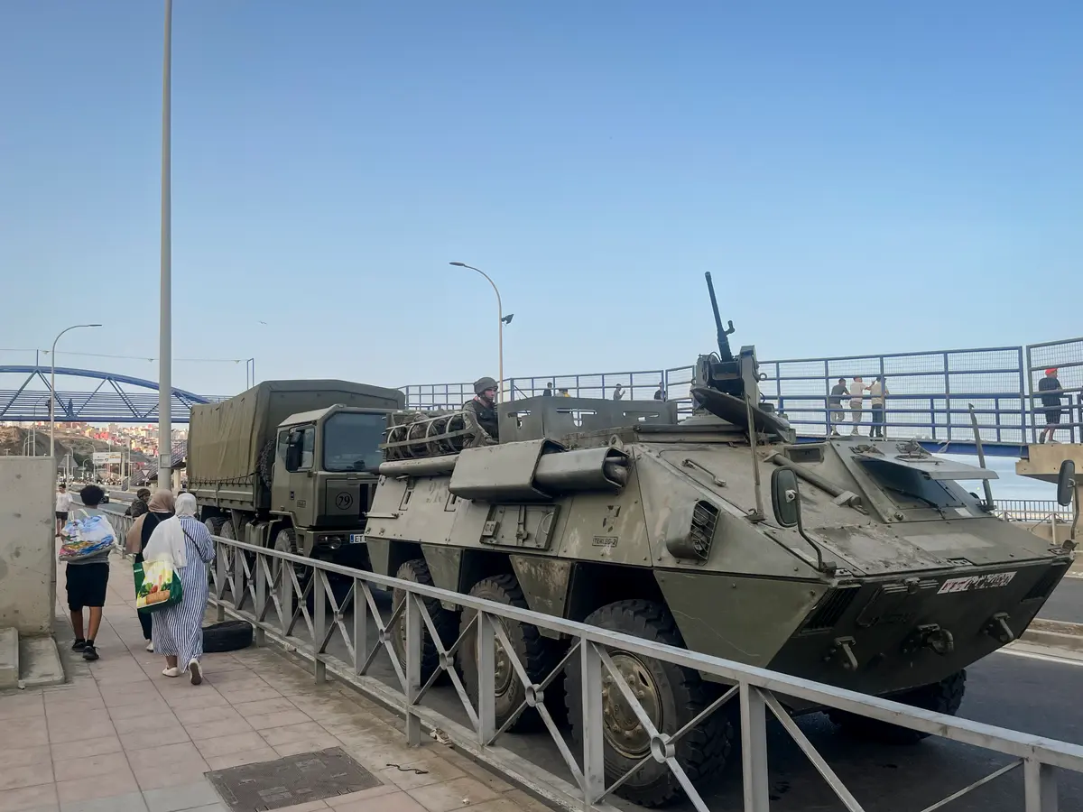 Spanish Army vehicles and soldiers deploy along the coastal road on Avenida Martínez Catena in the Spanish territory of Ceuta, on July 31, 2026, as part of the response to the migrant crisis. (Etienne Fauchaire/The Epoch Times)
