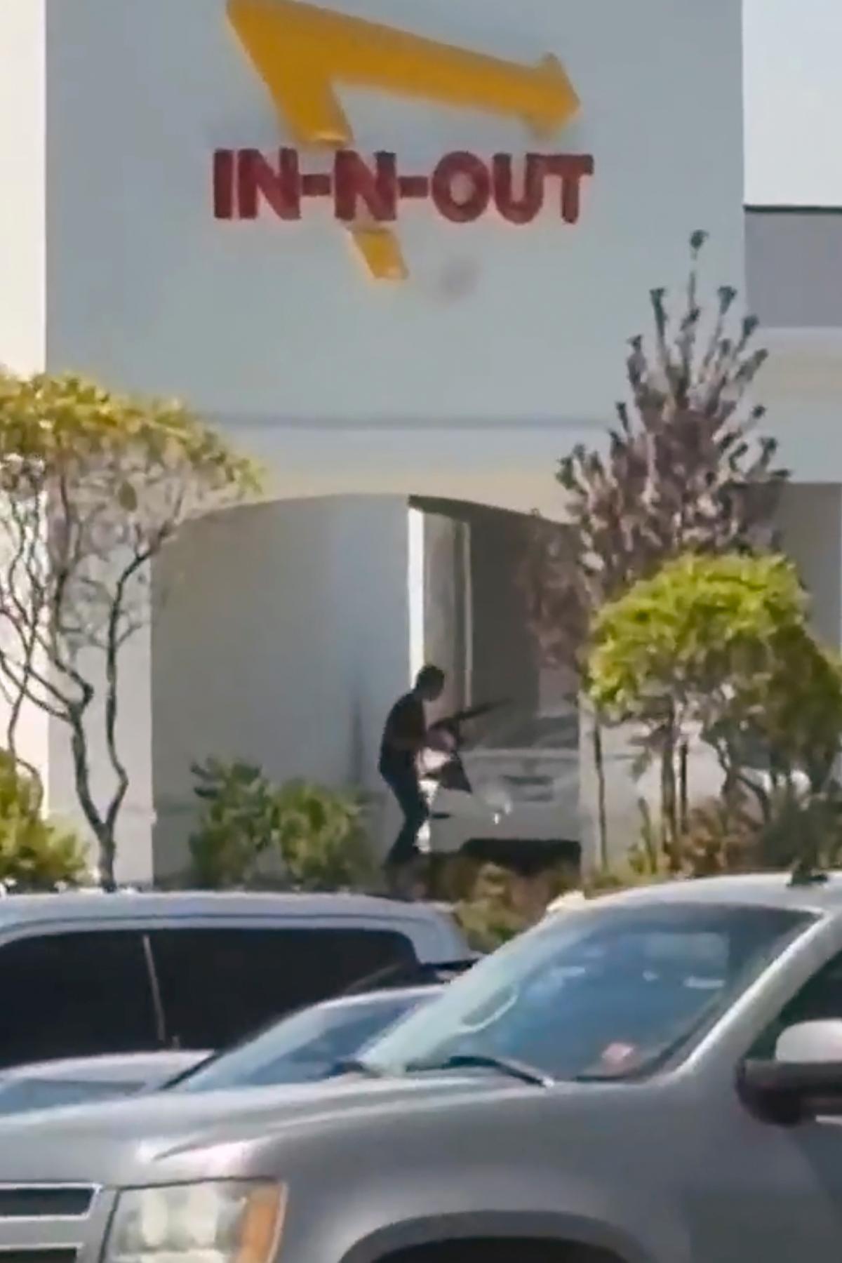 The scene of a shooting that started at an In-N-Out Burger restaurant in Twin Falls, Idaho, on Aug. 1, 2026, in a still from video. (Kevin Bell Jr. via AP)