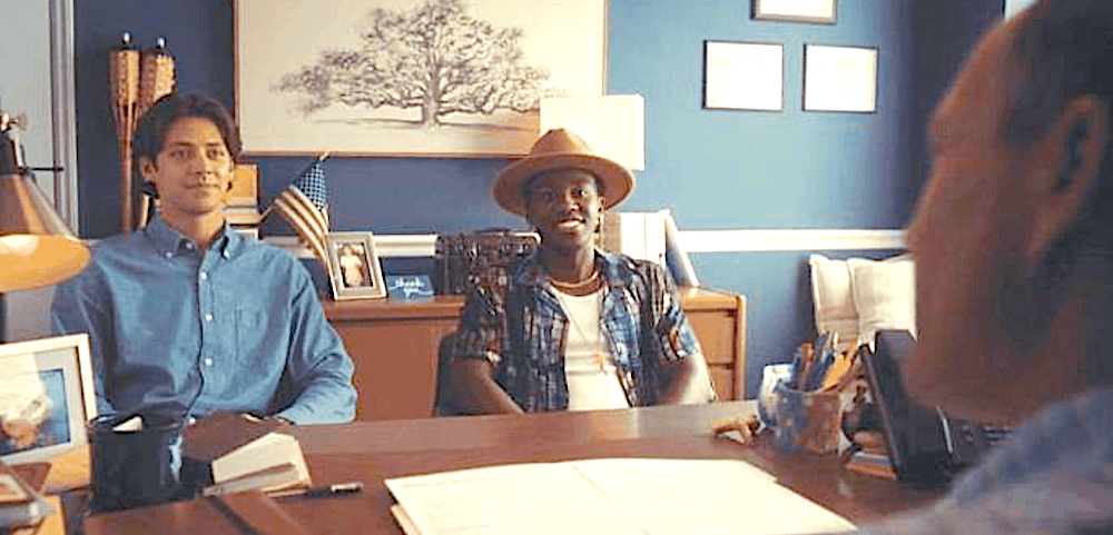 (L–R) Grayson (Matt Cornett) and Tyler (Ramon Reed) are interviewed by Pastor Tom (Chris Klein) for camp counselor positions in "Bad Counselors." (Zero Gravity Management/Narrow Gate Entertainment)