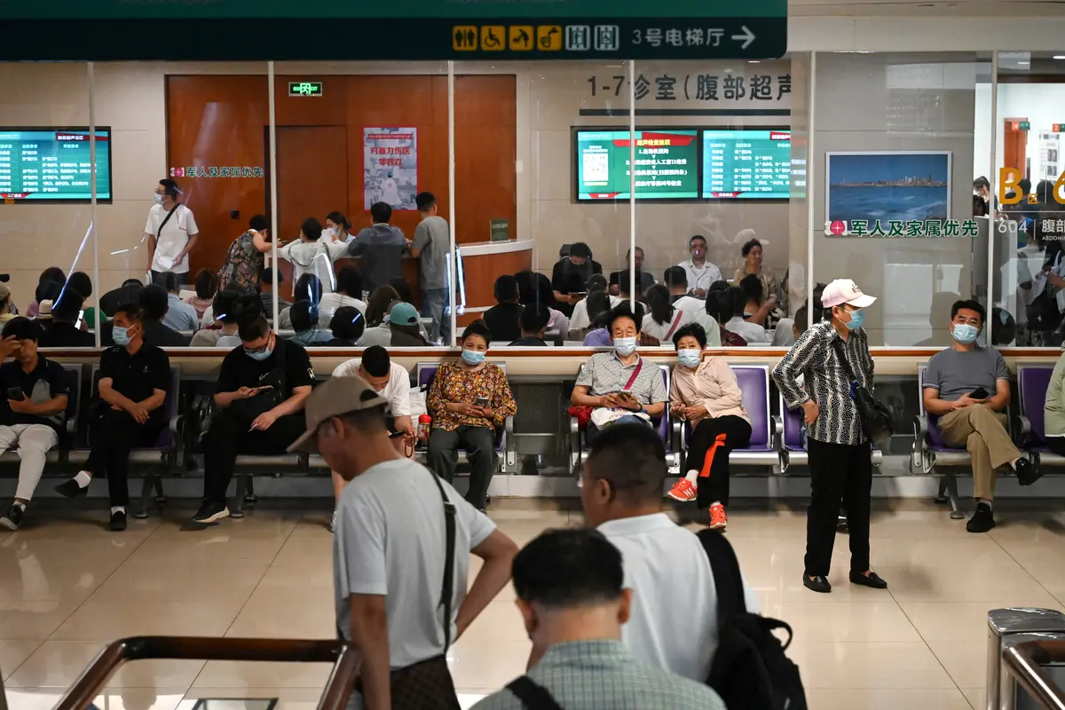 People wait at a hospital in Beijing on June 23, 2025. (Jade Gao/AFP via Getty Images)