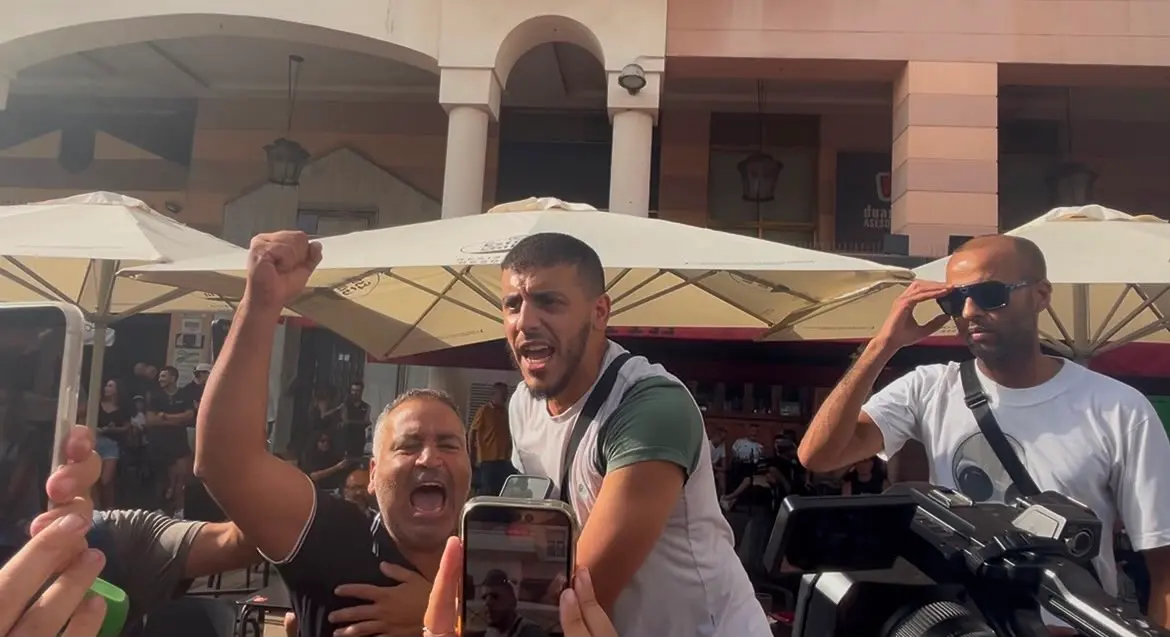 Protesters shout while opposing MEP Alvise Pérez in the heart of Ceuta, Spain, on Aug. 1, 2026. (Etienne Fauchaire/The Epoch Times)