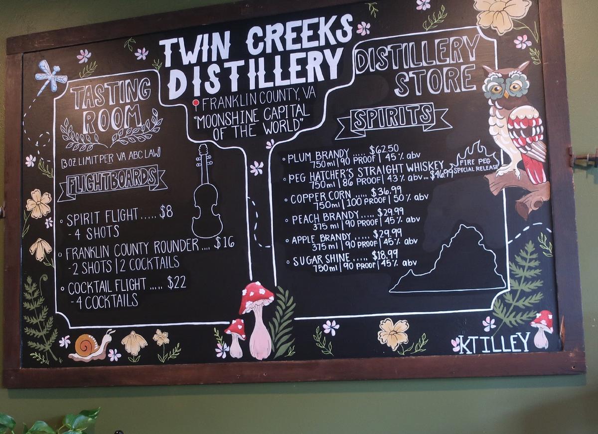 The postings on the menu board at Twin Creeks Distillery in Franklin County, Virginia, demonstrate the area's claim to be the 'Moonshine Capital of the World.' (Photo Courtesy of Victor Block)
