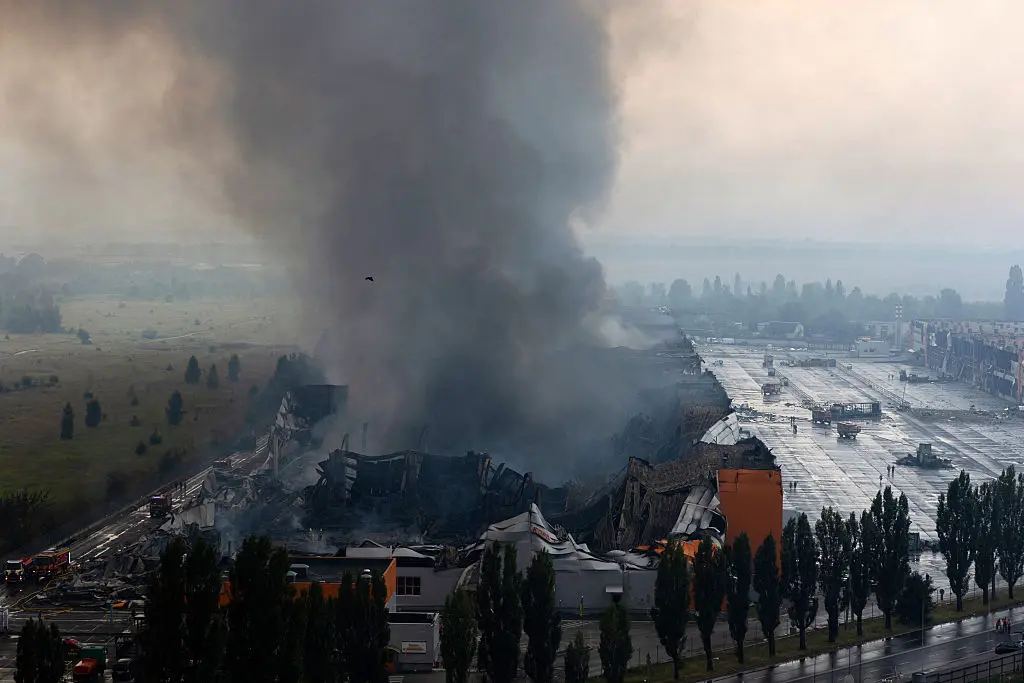 This photograph shows smoke rising from a fire following massive Russian ballistic missile and drone strikes in Kyiv on August 5, 2026. (Tetiana Dzhafarova/AFP via Getty Images)