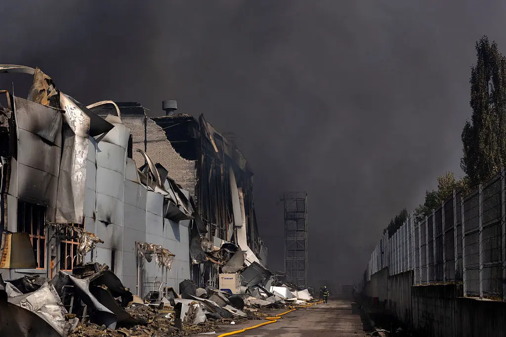 A Ukrainian firefighter works to put out a fire following massive Russian ballistic missile and drone strikes in Kyiv on August 5, 2026. (Tetiana Dzhafarova/AFP via Getty Images)
