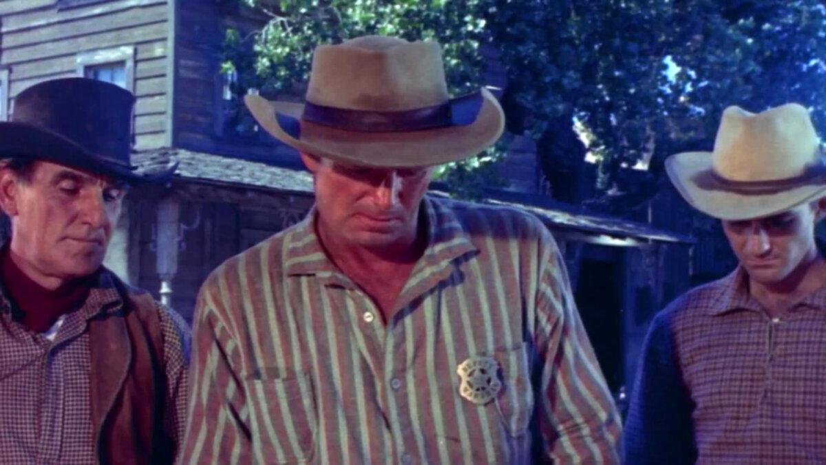Marshal Clay Hardin (Sterling Hayden, C) finds his friend dead, in “Shotgun.” (GJW+)