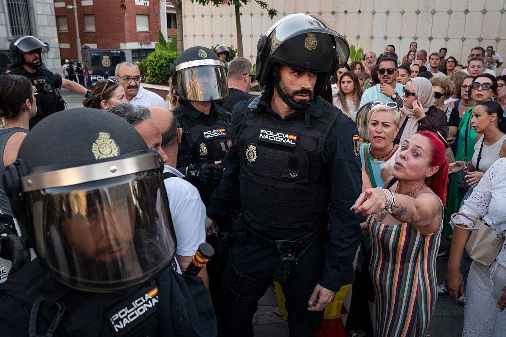 Spanish police attend as protesters and counter-protesters face each other during a demonstration in Ceuta, Spain, on Aug. 2, 2026. (Adri Salido/Getty Images)