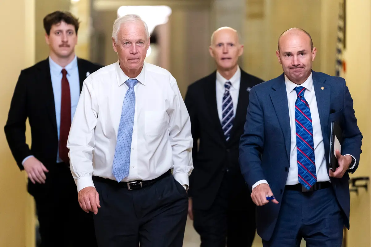 (L–R) Sen. Ron Johnson (R-Wis.), Sen. Rick Scott (R-Fla.), and Sen. Mike Lee (R-Utah) walk towards Senate Chambers in the U.S. Capitol Building in Washington on Aug. 7, 2026. (Finn Gomez/Getty Images)