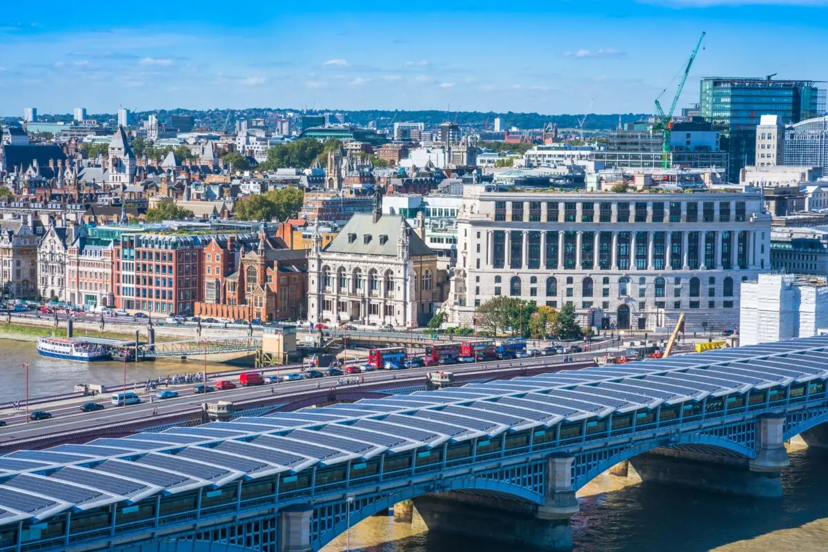 A panoramic, aerial view of the Victoria Embankment, Blackfriars Bridge, and the River Thames in London. The Unilever Building dominates the Victoria Embankment. (BBA Photography/Shutterstock)