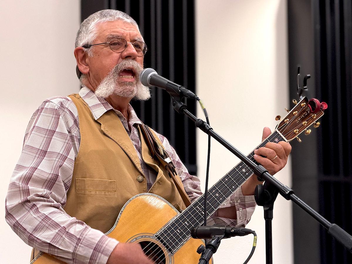 Western singer and rancher Randy Huston from Rociada, N.M., performs a song he wrote during a cowboy poets gathering in Prescott, Ariz., on Aug. 7, 2026. (Allan Stein/The Epoch Times)