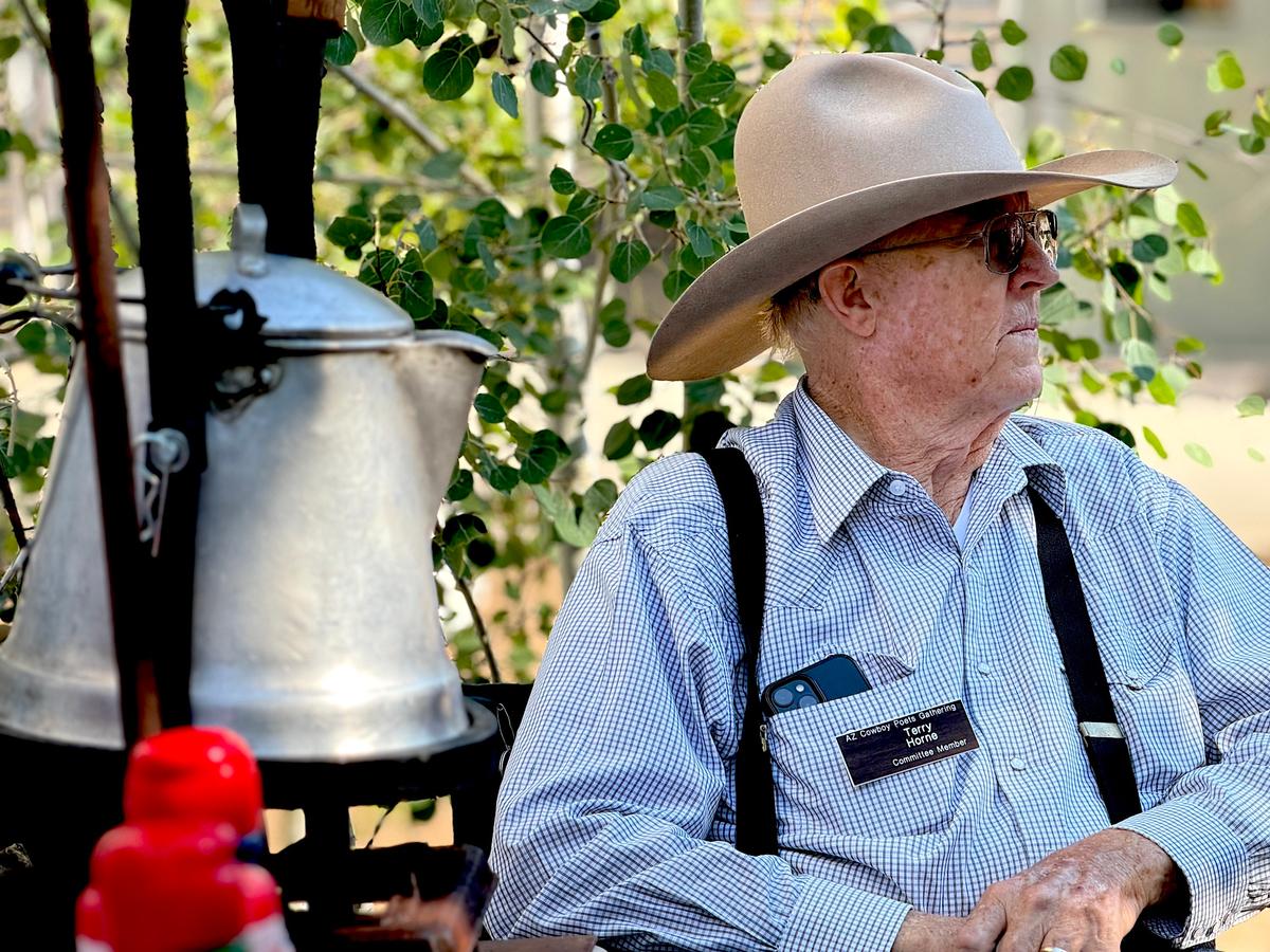 Committee member Terry Horne takes a break during Coffee With the Cowboys in Prescott, Ariz., on Aug. 8, 2026. (Allan Stein/The Epoch Times)