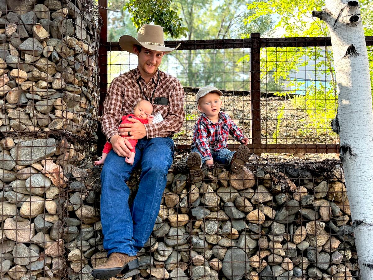 Cowboy singer and songwriter Clancy Ballard with his two children during Coffee With the Cowboys in Prescott, Ariz., on Aug. 8, 2026. (Allan Stein/The Epoch Times)