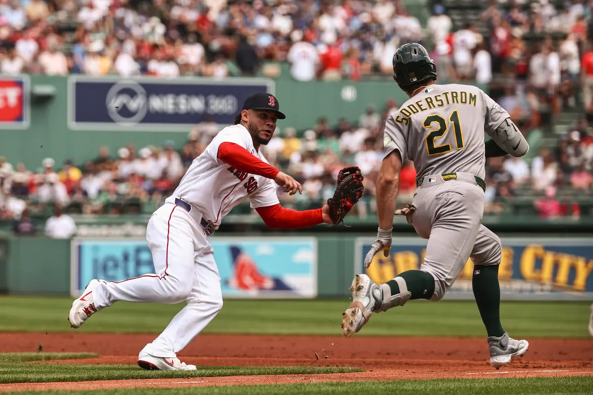 Willson Contreras #40 of the Boston Red Sox moves to tag out Tyler Soderstrom #21 of the Athletics on an infield ground ball during the first inning at Fenway Park in Boston on Aug. 9, 2026. (Winslow Townson/Getty Images)