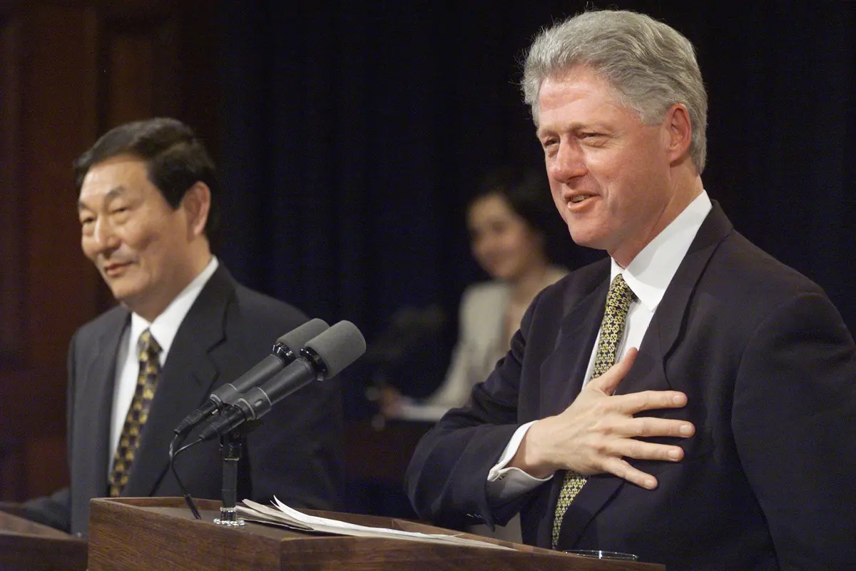 U.S. President Bill Clinton (R) responds to a question as Chinese Premier Zhu Rongji looks on during a joint news conference in the Old Executive Office Building in Washington, on April 8, 1999. (Tim Sloan/AFP via Getty Images)