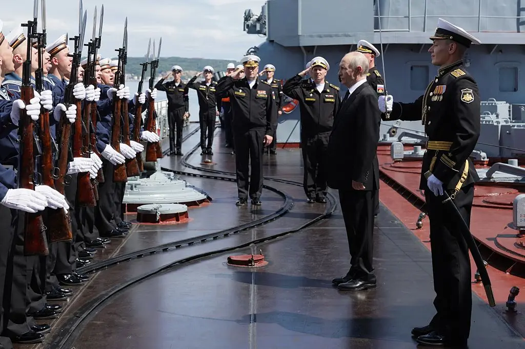 Russian President Vladimir Putin visits the Russian Navy's guided missile cruiser Varyag as he oversees the final stage of a Pacific Fleet's naval drills on far eastern Sakhalin Island on Aug. 12, 2026. (Gavriil Grigorov/ AFP via Getty Images)