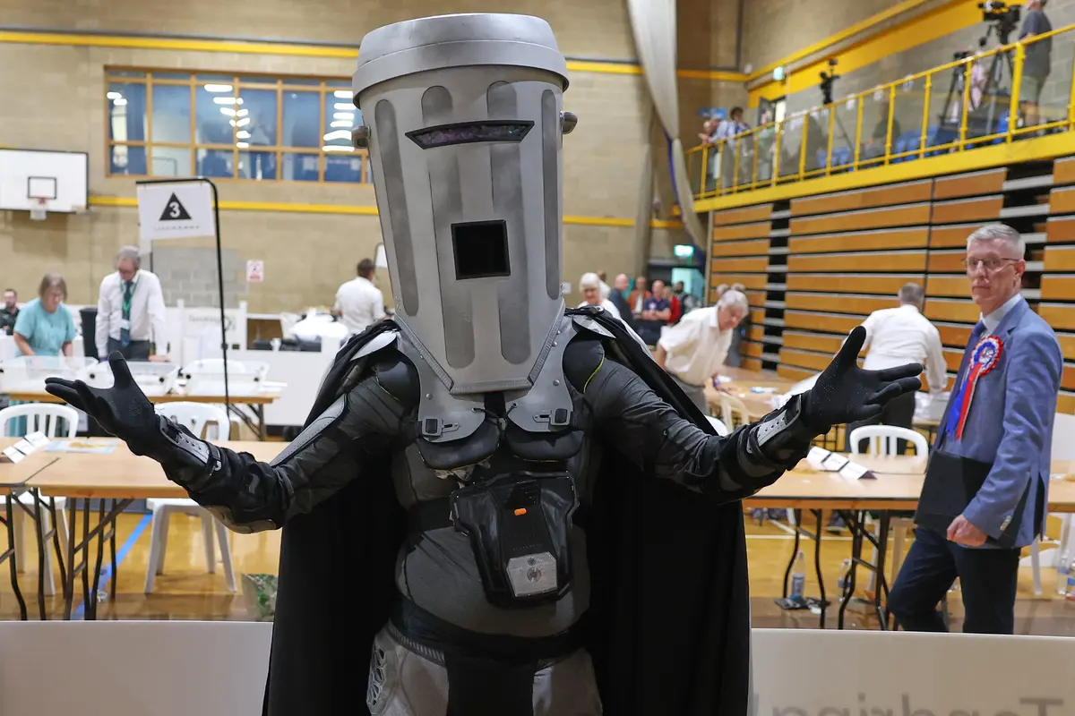 Candidate Count Binface poses for the media during the Clacton by-election count at the leisure center in Clacton-on-Sea, England, on Aug. 14, 2026. (Richard Pelham/AP Photo)