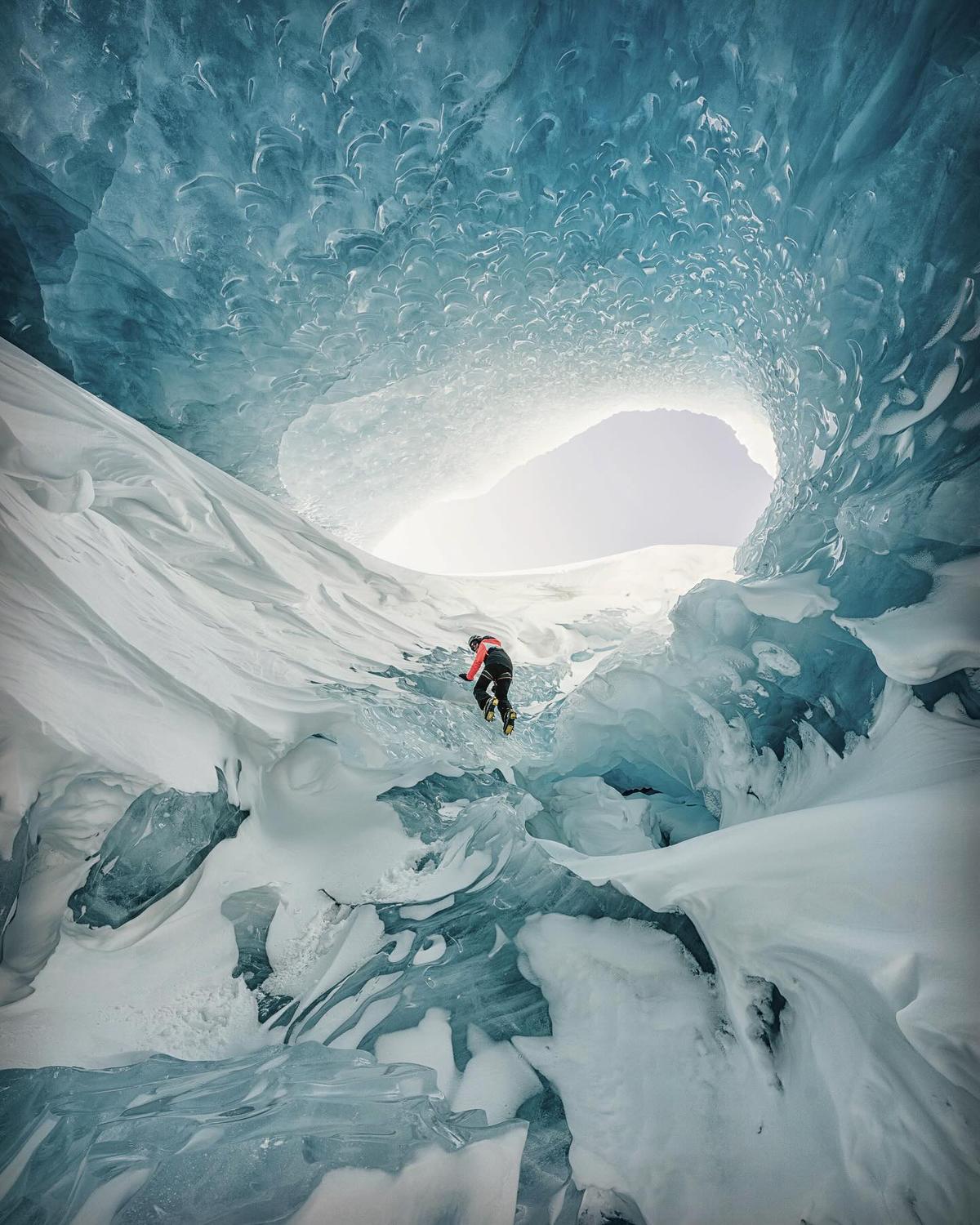 Kedhambadi’s ice cave photography includes “Yatra,” Sanskrit for “a journey,” capturing a huge glacier cave from the inside, as a fellow ice climber scales the frozen walls. The photo won runner-up placing in the Outdoor Adventure category for Canadian Geographic’s 2023 Photos of the Year competition. (Courtesy of Chandresh Kedhambadi)