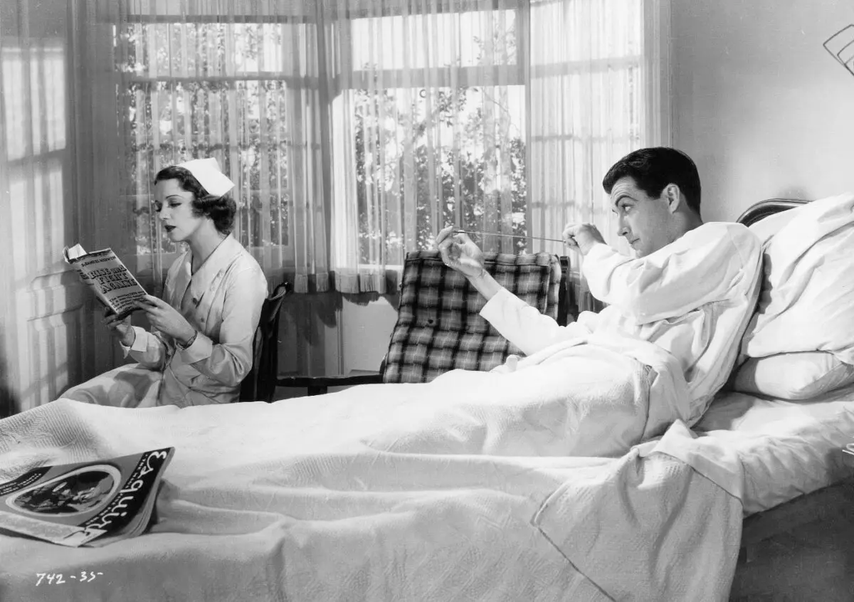 A nurse (Margaret Brayton) and playboy Robert Merrick (Robert Taylor), in "Magnificent Obsession." (Universal Pictures)