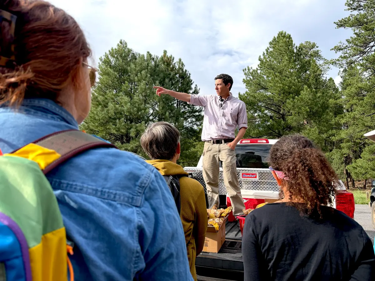 Mike Dechter, executive director of the Arizona Mushroom Society, during a group foray in the Coconino National Forest in northern Arizona on Aug. 14, 2026. (Allan Stein/The Epoch Times)