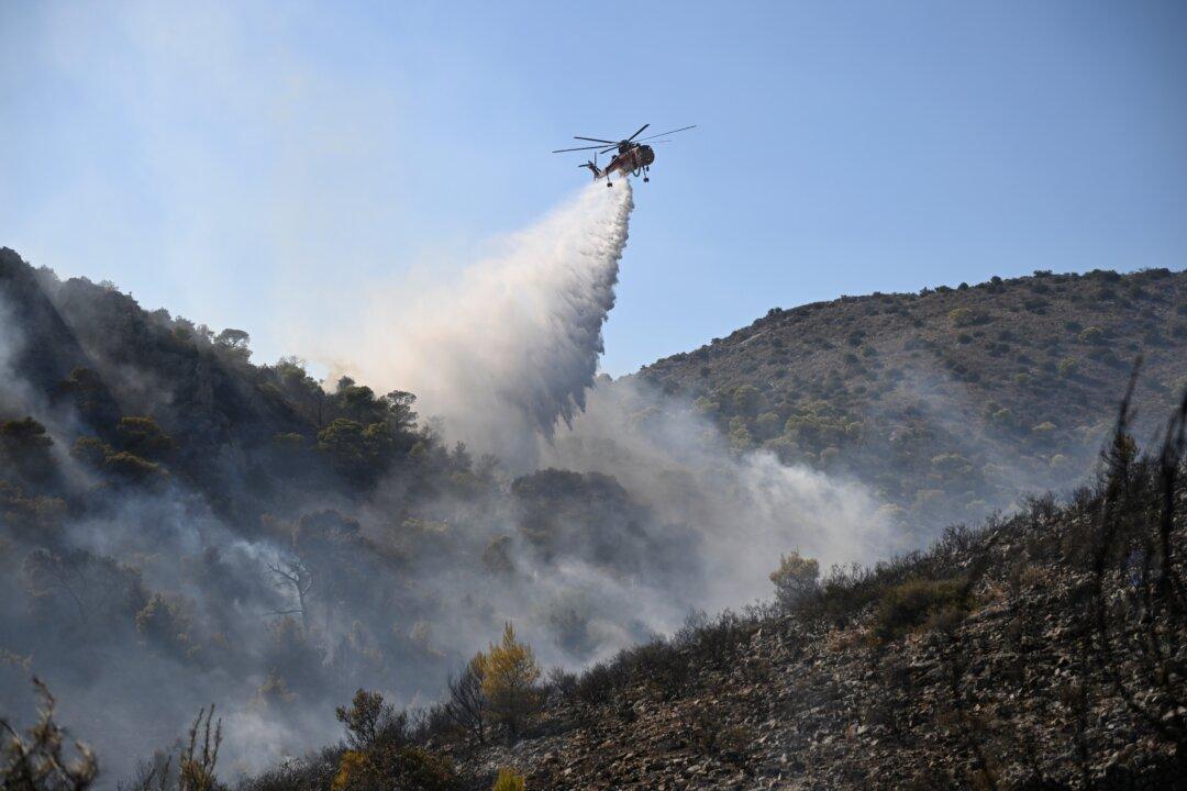 Firefighters Battle Massive Wildfires in Belgium and Greece as 2 Die on Island Near Athens