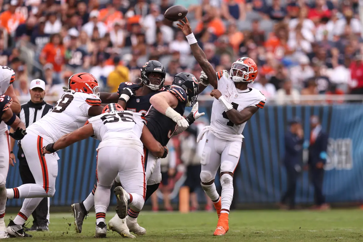 Deshaun Watson (4) of the Cleveland Browns scrambles out of the pocket and throws downfield during the second quarter of a preseason game against the Chicago Bears at Soldier Field in Chicago, on Aug. 15, 2026. (Geoff Stellfox/Getty Images)
