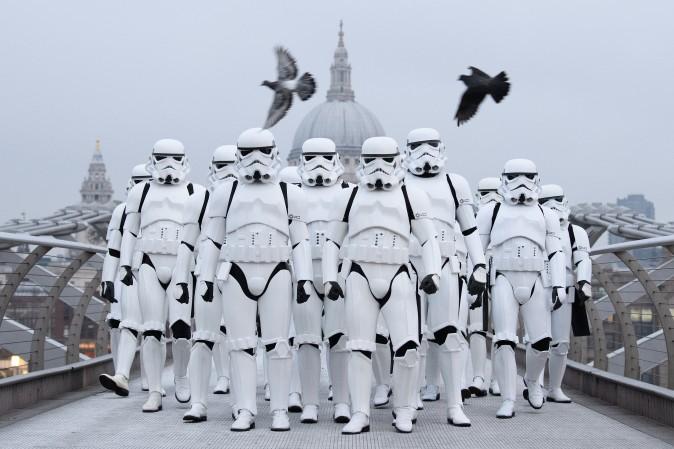 People dressed as Stormtroopers are on the Millennium Bridge to promote the latest release of the first "Star Wars," spin off series, "Rogue One: A Star Wars Story," in London on Dec. 15. (Leon Neal/Getty Images)
