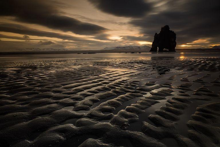 "Sunrise With the Ancients." Photographer Erez Marom describes: "The famous Dinosaur Rock in the beach of Hvítserkur, under a spectacular sunrise." (Erez Marom)