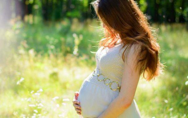 Undated file image of a pregnant woman holding her stomach.