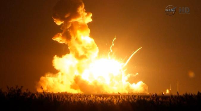 Orbital Sciences Corp.'s unmanned Antares rocket blows up over the launch complex at Wallops Island, Va., seconds after liftoff on Oct. 28, 2014. (AP Photo/NASA TV)
