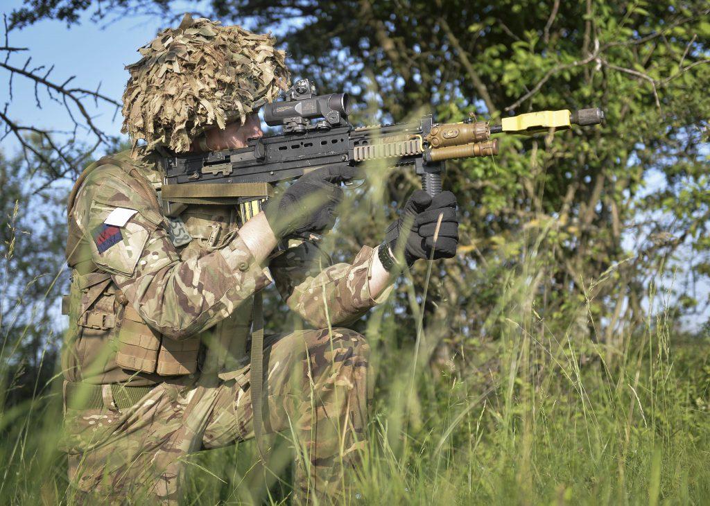 A member of the Grenadier Guards armed with an SA-80 taking part in Exercise Noble Jump 17, a logistical challenge that tests the ability of participants to deliver a fighting force to wherever it is needed. (UK Ministry of Defence)<br/><br/><br/>