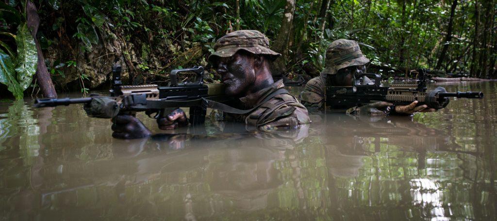 Soldiers from the 1st Battalion of the Irish Guards conducting a live firing exercise in the Belize Jungle. (UK Ministry of Defence)