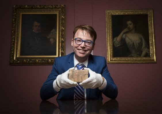 Dr. Daniel Mansfield with the Plimpton 322 Babylonian clay tablet in the Rare Book and Manuscript Library at Columbia University in New York. (Andrew Kelly/UNSW)