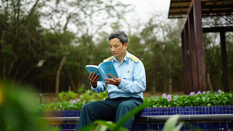 The author reading Zhuan Falun, the main book of the Falun Dafa teachings.