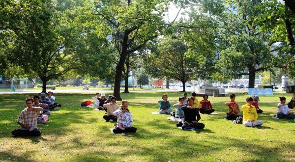 Falun Dafa practitioners meditate at Queen’s Park in Toronto, in September 2017. The writer immigrated to Canada in 2008. (Minghui.org)