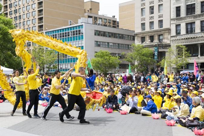 A Falun Gong dragon dance team performs at the World Falun Dafa Day event at Union Square, New York City, on May 11, 2017. (Samira Bouaou/The Epoch Times)