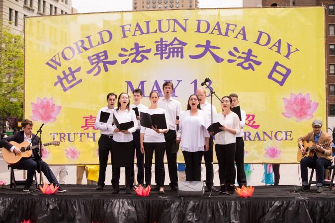 A choir of Falun Dafa practitioners sing at the World Falun Dafa Day event at Union Square, New York City, on May 11, 2017. (Larry Dye/The Epoch Times)