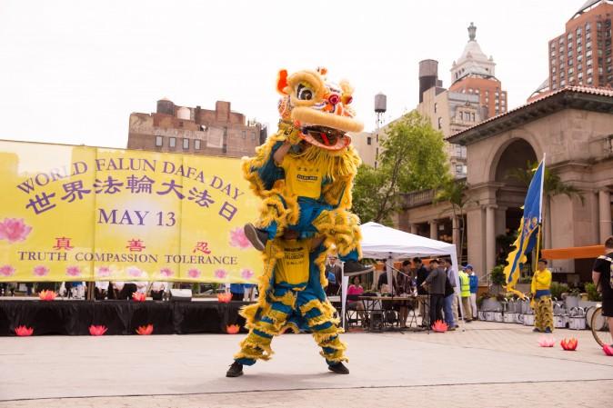 A lion dance team performs during the World Falun Dafa Day event at Union Square, New York City, on May 11, 2017. (Larry Dye/The Epoch Times)