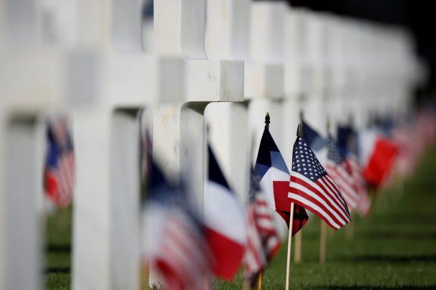 U.S. and French flags are seen in the American cemetery of Colleville-sur-Mer in Normandy, France, on June 6, 2019. (Christian Hartmann/Reuters)