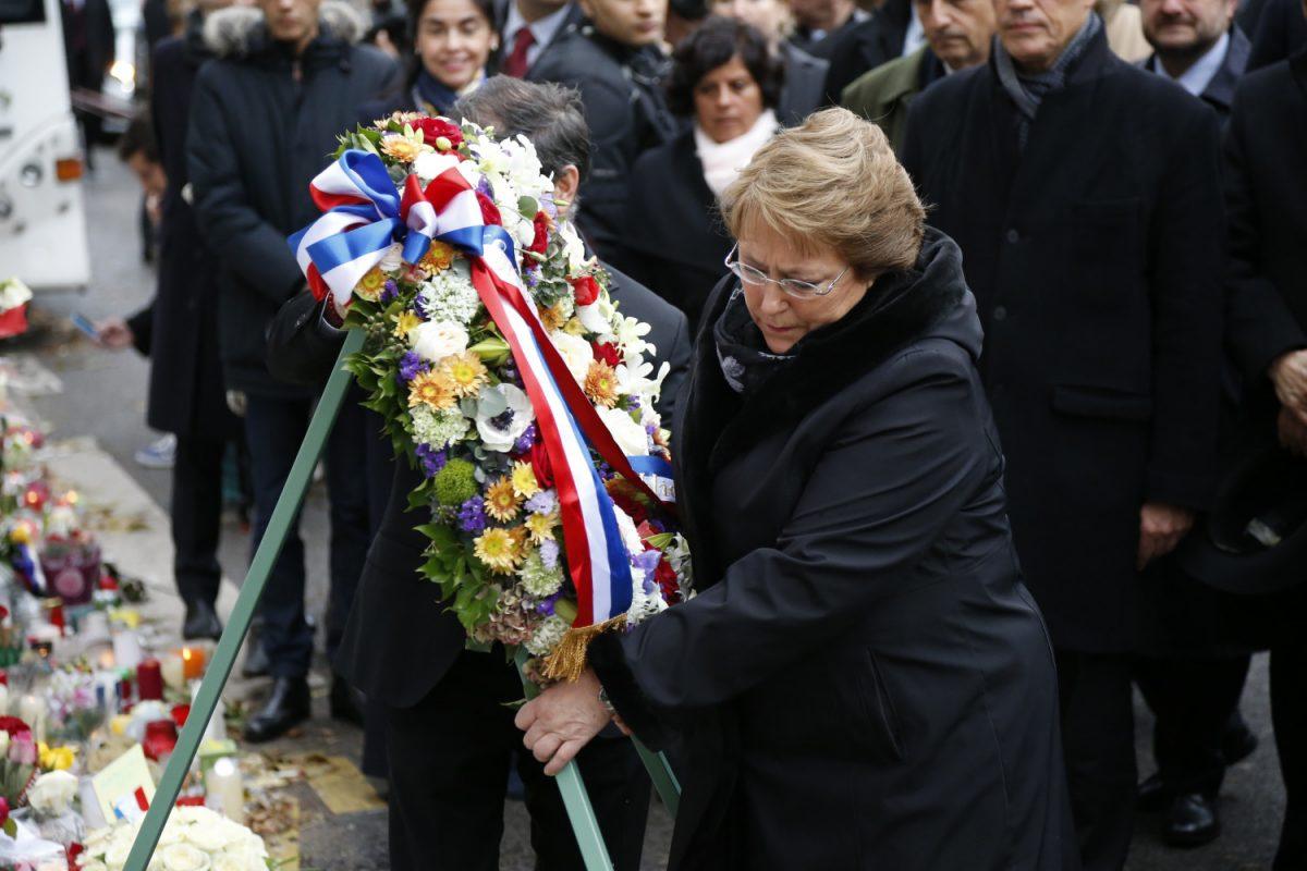 Chile's President Michele Bachelet places a wreath as she pays tribute to the victims of the Bataclan concert hall attack, on Nov. 29, 2015 in Paris, two weeks after the Nov. 13 series of shooting and suicide bombing that killed 130 and injured more than 360 people. (Matthieu AlexandreE/AFP/Getty Images)