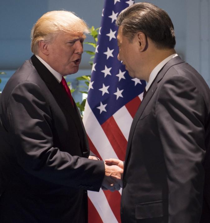 U.S. President Donald Trump and Chinese leader Xi Jinping (R) shake hands prior to a meeting on the sidelines of the G-20 summit in Hamburg, Germany, July 8, 2017. (Saul Loeb/AFP/Getty Images)