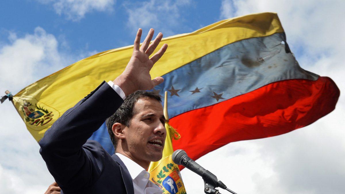 Venezuela's National Assembly head Juan Guaido speaks to the crowd during a mass opposition rally against socialist dictator Nicolas Maduro in which he declared himself the country's 'acting president', on the anniversary of a 1958 uprising that overthrew a military dictatorship, in Caracas on Jan. 23, 2019. (Federico Parra/AFP)