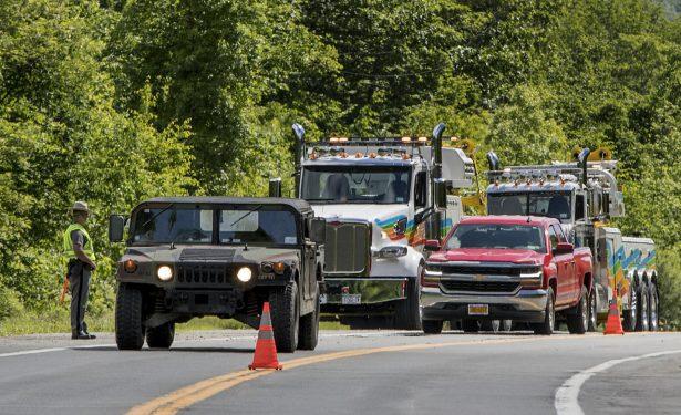 Military police direct traffic along Route 293 near the site where an armored personnel vehicle overturned killing at least one person, in Cornwall, N.Y., on June 6, 2019. (Allyse Pulliam/AP Photo)