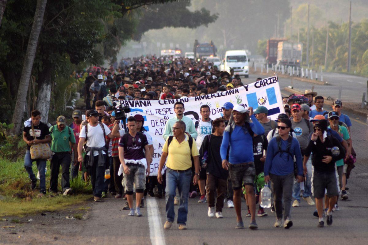 Migrants from Central America and Cuba walk on a highway during their journey towards the United States, in Tuzantan, Chiapas state, Mexico, on March 25, 2019. (Jose Torres/Reuters)
