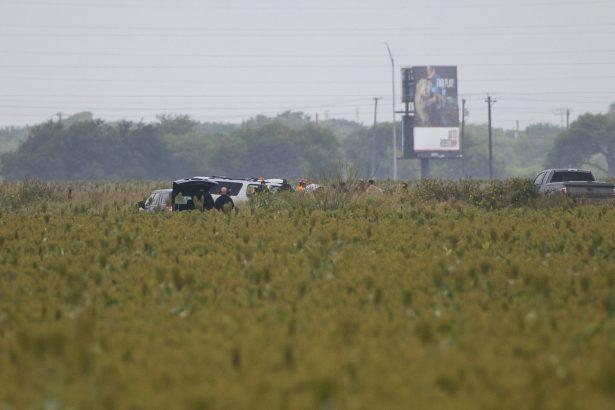 Law enforcement moves a vehicle as they investigate a fatal wreck that left six migrants dead and several others injured outside Robstown, Texas on June 5, 2019. (Courtney Sacco/Corpus Christi Caller-Times via AP)
