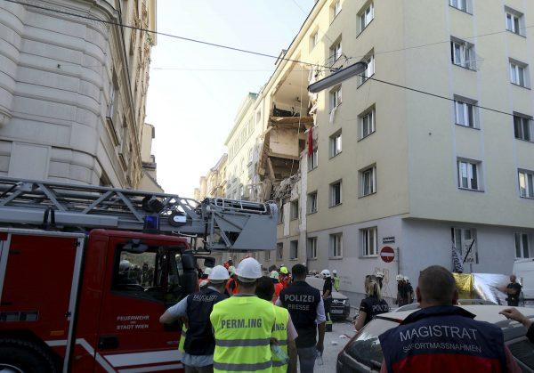 Firefighters search through the rubble of a exploded building in Vienna, Austria, Wednesday, June 26, 2019. (Ronald Zak/AP Photo)