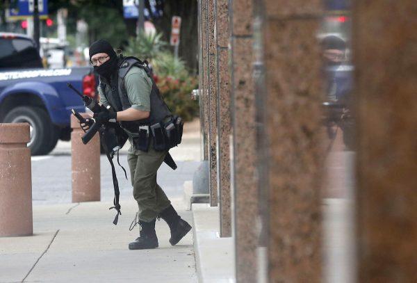 An armed shooter (shown) attacks at the Earle Cabell federal courthouse in downtown Dallas on June 17, 2019. (Tom Fox/The Dallas Morning News)