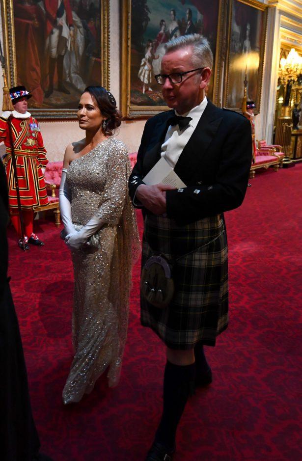 Stephanie Grisham, director of communications for First Lady Melania Trump, left, with Britain's Environment, Food and Rural Affairs Secretary Michael Gove, in Buckingham Palace in London on June 3, 2019. (Victoria Jones/AFP/Getty Images)