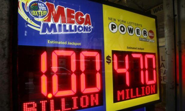 signs displaying the jackpots for Mega Millions and Powerball lottery drawings at a newsstands in midtown Manhattan in New York on Oct. 19, 2018. (Mike Sugar/Reuters)